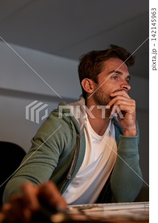 Man, computer and office for overtime, thinking and burnout for small business startup. Web designer, stress and technology with workplace, night and working with email for website issue or mistake 142145963