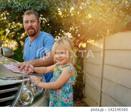 Outdoors, man and girl with cleaning car in backyard for maintenance, teamwork and childhood development. Dad, portrait and kid in nature with washing vehicle for teaching, hygiene and support 142146160