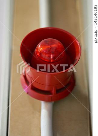 Emergency, siren and speaker for fire alarm, warning and evacuation with safety regulations or compliance. Red light on wall for security alert, noise and danger with sound, electricity and risk Emergency, siren and speaker for fire alarm, warning and evacuation with safety regulations or compliance. Red light on wall for security alert, noise and danger with sound, electricity and risk 142146195