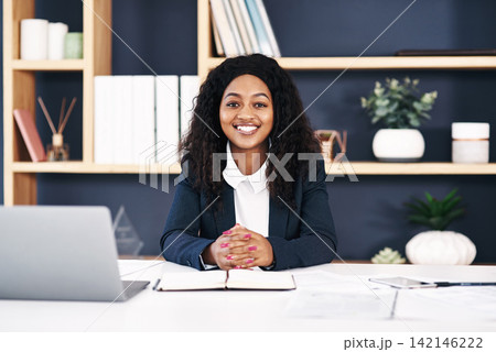 Black woman, laptop and online for research at office for website as web designer for agency. Female employee, portrait and internet for creative or ideas for work, project and startup business Black woman, laptop and online for research at office for website as web designer for agency. Female employee, portrait and internet for creative or ideas for work, project and startup business 142146222