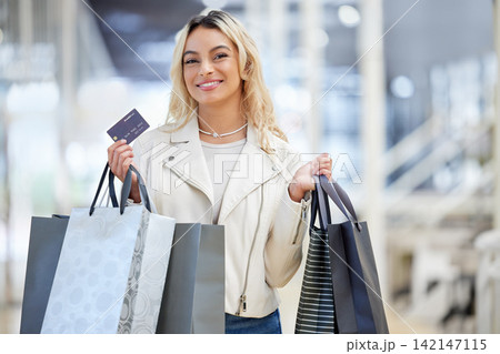 Shopping bag, portrait or happy woman with credit card in mall for bargain, choice or financial payment. Clothes, fashion deal or customer with package for purchase, boutique offer or retail promo Shopping bag, portrait or happy woman with credit card in mall for bargain, choice or financial payment. Clothes, fashion deal or customer with package for purchase, boutique offer or retail promo 142147115