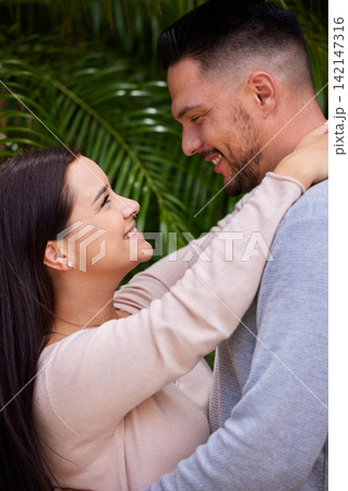 Happy couple, hug and affection with love for care, support or romance together in nature. Man, woman or lovers with smile in happiness for embrace, date or relationship on holiday at outdoor park 142147316