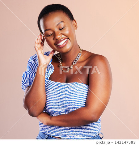 Black woman, laugh and thinking with fashion, modern and influencer style in a studio. Trendy, clothes and funny joke with happy university student from Houston with orange background and smile 142147395
