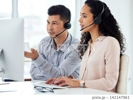 Call centre, man and woman with manager, typing and computer for website and market research online. Tech support, help and customer service with headset or headphones, training and communication Call centre, man and woman with manager, typing and computer for website and market research online. Tech support, help and customer service with headset or headphones, training and communication 142147961