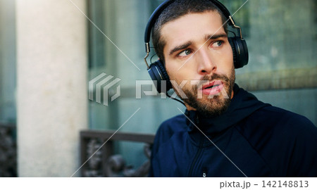 Music headphones, man or runner in city ready for workout, training or outdoor exercise with radio audio. Sports podcast, listening or athlete for running for energy, wellness or fitness in England Music headphones, man or runner in city ready for workout, training or outdoor exercise with radio audio. Sports podcast, listening or athlete for running for energy, wellness or fitness in England 142148813