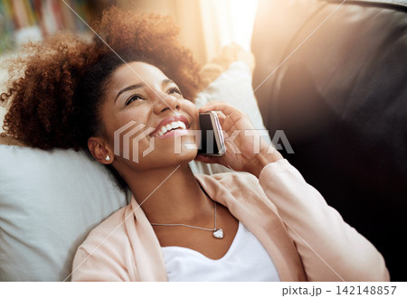 Woman, home and sofa or relax on phone call, chatting and living room for comfort on smartphone with internet. Conversation, laugh and funny discussion, listening and connected for communication 142148857