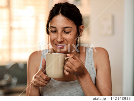 Woman, smell and coffee in kitchen at house for drinking brewed, aroma and caffeine for breakfast. Female person, beverage and breathe, fresh and morning fix to feel energy, relaxed and refreshed Woman, smell and coffee in kitchen at house for drinking brewed, aroma and caffeine for breakfast. Female person, beverage and breathe, fresh and morning fix to feel energy, relaxed and refreshed 142148938