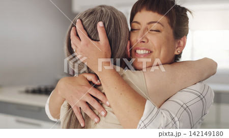 Woman, senior mother and hug in home for reunion with happiness, weekend visit and support for elderly care. Daughter, mature mom and embrace for love for mothers day, relationship and smile together 142149180