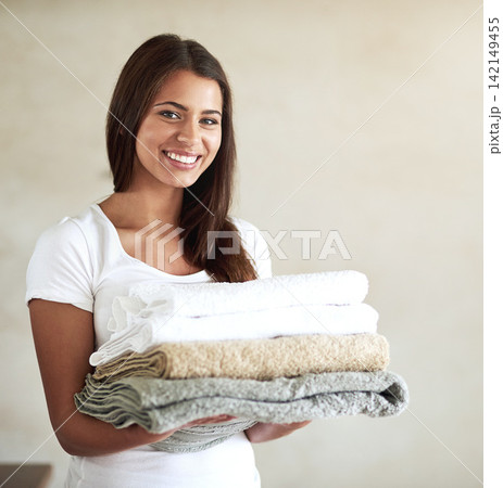 Hotel, cleaner and portrait of woman with towels, laundry or happy to work in house cleaning service. Girl, smile and maid washing linen for sanitary hygiene in home or apartment with hospitality Hotel, cleaner and portrait of woman with towels, laundry or happy to work in house cleaning service. Girl, smile and maid washing linen for sanitary hygiene in home or apartment with hospitality 142149455