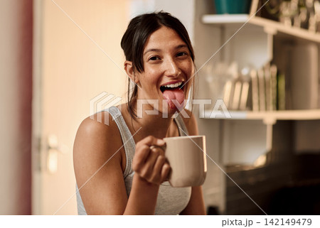 Happy, woman and coffee in kitchen at house for portrait with smile for caffeine as breakfast. Female person, beverage and playful, fresh and morning fix to feel energy, relaxed and refreshed 142149479