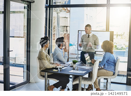 Businessman, coaching and discussion with team in meeting, presentation or conference at office. Man or speaker talking to employees for company investment, revenue or financial growth at workplace Businessman, coaching and discussion with team in meeting, presentation or conference at office. Man or speaker talking to employees for company investment, revenue or financial growth at workplace 142149571