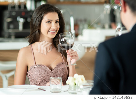 Date, smile and wine with couple in restaurant for luxury dinner or fine dining hospitality together. Anniversary, love or romance with woman and man at table for bonding, celebration or drinking 142149658