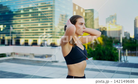 Woman, athlete and tired after run in urban city for fitness, health and exercise in town for summer. Female person, runner and training in Los Angeles for breathing, cardio and wellness with fatigue Woman, athlete and tired after run in urban city for fitness, health and exercise in town for summer. Female person, runner and training in Los Angeles for breathing, cardio and wellness with fatigue 142149686