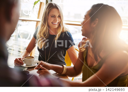 Smile, students and friends drinking coffee in shop for talking, conversation or social gathering together in restaurant. Happy women, group and relax in cafe for chat, news or laughing gossip story 142149693