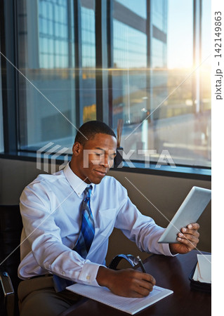 Businessman, accounting and writing with tablet for finance, legal paperwork or budget planning at office. Black man, financial advisor or accountant taking notes with technology for report or audit Businessman, accounting and writing with tablet for finance, legal paperwork or budget planning at office. Black man, financial advisor or accountant taking notes with technology for report or audit 142149863