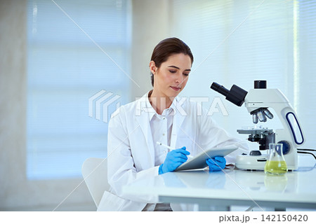 Scientist, microscope and woman at work with tablet for medical study, innovation and stem cell results. Investigation, analysis and person with biotechnology for dna, research or test for bacteria Scientist, microscope and woman at work with tablet for medical study, innovation and stem cell results. Investigation, analysis and person with biotechnology for dna, research or test for bacteria 142150420