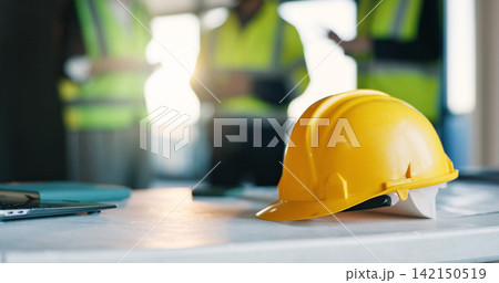 Architect, helmet and meeting in office for safety inspection, workplace injury prevention and rules. People, collaboration and hard hat for construction project, PPE compliance or protocol for team. 142150519