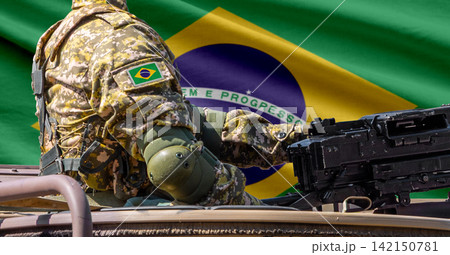 Brazil flag with soldier at machinegun turret 142150781