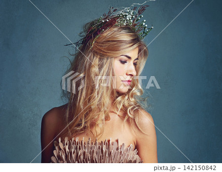 Woman, beauty and thinking with crown in hair, artistic model or fashion accessory for spring. Young person, designer head piece and beautiful for mythology or fairy character and stylish elegant Woman, beauty and thinking with crown in hair, artistic model or fashion accessory for spring. Young person, designer head piece and beautiful for mythology or fairy character and stylish elegant 142150842