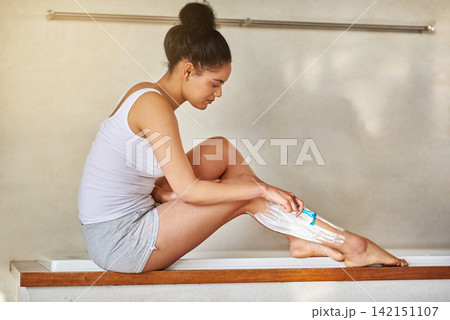 Happy woman, legs and epilation with shave for grooming, hygiene or hair removal in bathroom at home. Female person or model with razor blade, cream or lotion in depilation treatment for skincare Happy woman, legs and epilation with shave for grooming, hygiene or hair removal in bathroom at home. Female person or model with razor blade, cream or lotion in depilation treatment for skincare 142151107