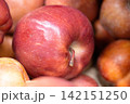 Fresh ripe apples close-up. Fresh ripe apples with a beautiful red-yellow blush. Fruit and vegetable stand. Autumn harvest. 142151250