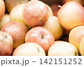 Fresh ripe apples close-up. Fresh ripe apples with a beautiful red-yellow blush. Fruit and vegetable stand. Autumn harvest. 142151252