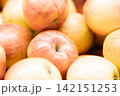 Fresh ripe apples close-up. Fresh ripe apples with a beautiful red-yellow blush. Fruit and vegetable stand. Autumn harvest. 142151253