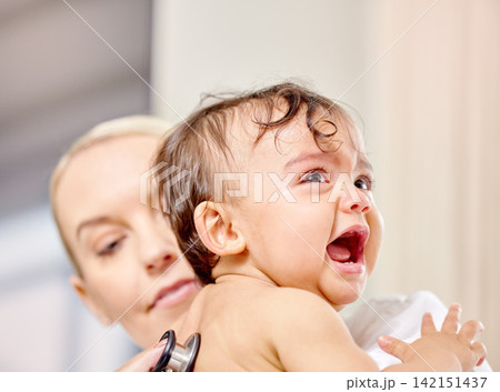 Sick baby, crying and medical woman with stethoscope for check up, healthcare and illness in family clinic. Child, female physician and hospital bed for upset kid, pediatrician and unwell infant Sick baby, crying and medical woman with stethoscope for check up, healthcare and illness in family clinic. Child, female physician and hospital bed for upset kid, pediatrician and unwell infant 142151437