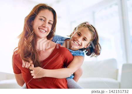 Piggyback, portrait and mom with kid in living room for love, trust or gratitude on mothers day. Woman, daughter and happy at home with affection for appreciation, support or family bonding together 142151732
