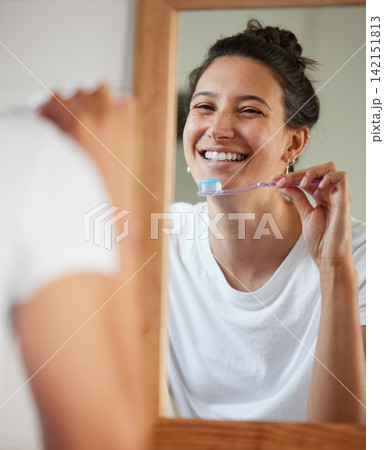 Woman, toothbrush and smile by mirror in morning to start routine for hygiene, health or oral wellness. Girl, person and toothpaste in reflection to check results, teeth whitening and mouth in home Woman, toothbrush and smile by mirror in morning to start routine for hygiene, health or oral wellness. Girl, person and toothpaste in reflection to check results, teeth whitening and mouth in home 142151813