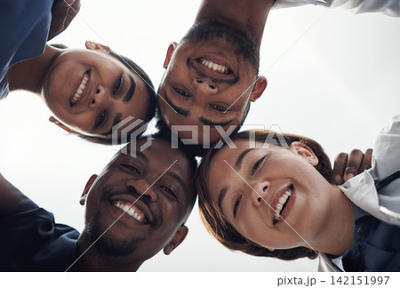Doctors, circle and below in portrait with smile, support and solidarity for medical career in hospital. Medic team building, men and women in collaboration, wellness or huddle for healthcare service 142151997