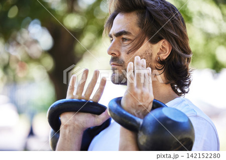 Outdoor, workout and man with kettlebell in park for exercise, training and fitness in nature. Sports, male person and equipment for muscle strength, physical and wellness with weight lifting Outdoor, workout and man with kettlebell in park for exercise, training and fitness in nature. Sports, male person and equipment for muscle strength, physical and wellness with weight lifting 142152280