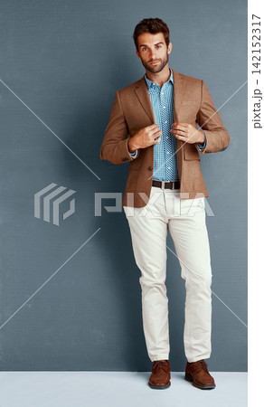 Relax, style and portrait of man with confidence, creative career and professional in studio. Business, trendy fashion and businessman on grey background with pride, opportunity and designer clothes Relax, style and portrait of man with confidence, creative career and professional in studio. Business, trendy fashion and businessman on grey background with pride, opportunity and designer clothes 142152317