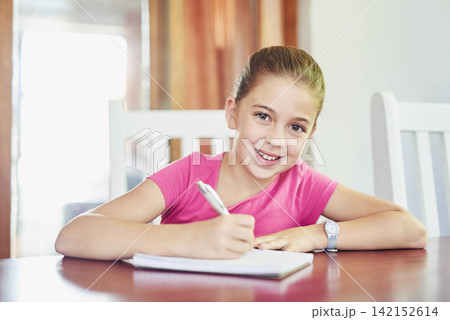 Girl, writing and book on table, portrait and kitchen in house, smile and homework with notebook. Happiness, kid and student in home, studying and joy for knowledge, development and growth for child Girl, writing and book on table, portrait and kitchen in house, smile and homework with notebook. Happiness, kid and student in home, studying and joy for knowledge, development and growth for child 142152614