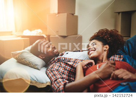 Black couple, relax and happy on floor of new house with bonding, support and break from moving. People, homeowner and excited for property investment, dream home or real estate relocation with boxes Black couple, relax and happy on floor of new house with bonding, support and break from moving. People, homeowner and excited for property investment, dream home or real estate relocation with boxes 142152724
