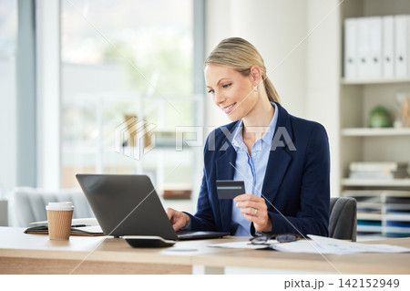 Business woman, laptop and credit card for online shopping, ecommerce and purchase on a website at work. Office, desk and internet payment at a company with a smile from digital store deal and sale 142152949