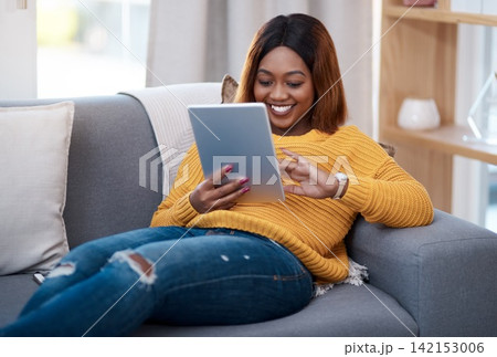 Tablet, search and happy black woman on sofa with social media, reading or website scroll at home. Digital, research or student with streaming app for sign up, online course or elearning registration Tablet, search and happy black woman on sofa with social media, reading or website scroll at home. Digital, research or student with streaming app for sign up, online course or elearning registration 142153006