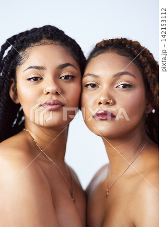 Serious, friends and portrait with makeup in studio for dermatology treatment, cosmetics and pride. Women, relax and face with confidence for skin glow, solidarity or satisfaction on white background Serious, friends and portrait with makeup in studio for dermatology treatment, cosmetics and pride. Women, relax and face with confidence for skin glow, solidarity or satisfaction on white background 142153112