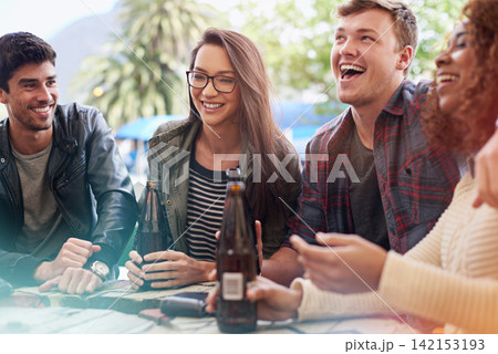Friends with beer, drinking and laughing together in pub, restaurant outdoors and reunion on weekend. People, men and women with social gathering, celebration and alcohol with happiness or joy Friends with beer, drinking and laughing together in pub, restaurant outdoors and reunion on weekend. People, men and women with social gathering, celebration and alcohol with happiness or joy 142153193