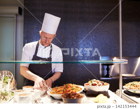 Chef, man and food in kitchen of restaurant for catering industry for meal with hospitality or fine dining with nutrition. Professional, expert and cooking cuisine for lunch or dinner for service Chef, man and food in kitchen of restaurant for catering industry for meal with hospitality or fine dining with nutrition. Professional, expert and cooking cuisine for lunch or dinner for service 142153444