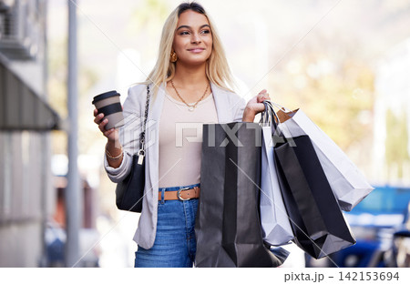Outdoor, woman and shopping with bags, retail or happiness with luxury products, New York or discount deal. Person, consumer or girl with sale, summer or fashion in urban town with purchase or coffee 142153694