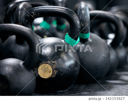 Gym, equipment and kettlebell for exercise, iron and sports for strength. Functional fitness, weight and lifting for strong athlete and training for health and wellness, bodybuilding and gear in club Gym, equipment and kettlebell for exercise, iron and sports for strength. Functional fitness, weight and lifting for strong athlete and training for health and wellness, bodybuilding and gear in club 142153927