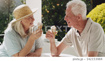 Senior, couple or ice cream in garden with talk for retirement, planning vacation for anniversary. Husband, wife or old on patio for conversation with gelato, sunshine in summer with partner in home Senior, couple or ice cream in garden with talk for retirement, planning vacation for anniversary. Husband, wife or old on patio for conversation with gelato, sunshine in summer with partner in home 142153984