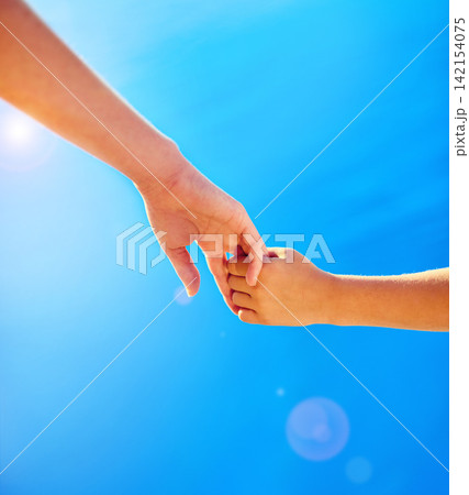 Parent, child and holding hands closeup in sky for trust, support and care together or bonding in nature. Love, comfort and people, help and kid in the afternoon sunshine with kindness in summer Parent, child and holding hands closeup in sky for trust, support and care together or bonding in nature. Love, comfort and people, help and kid in the afternoon sunshine with kindness in summer 142154075