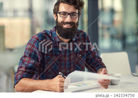 Documents, portrait and writing with designer man in office for artistic project management. Design, paper and smile of happy young employee with beard in creative workplace for proposal development Documents, portrait and writing with designer man in office for artistic project management. Design, paper and smile of happy young employee with beard in creative workplace for proposal development 142154750