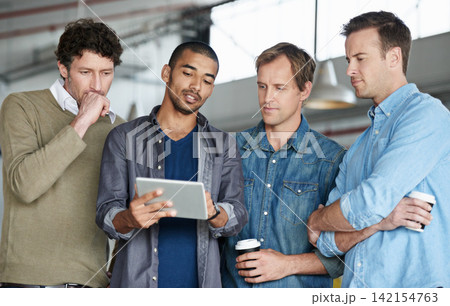 Creative man, meeting and group with tablet for collaboration, presentation or research at office. Team of employees listening to speaker or presenter on technology for startup together at workplace Creative man, meeting and group with tablet for collaboration, presentation or research at office. Team of employees listening to speaker or presenter on technology for startup together at workplace 142154763