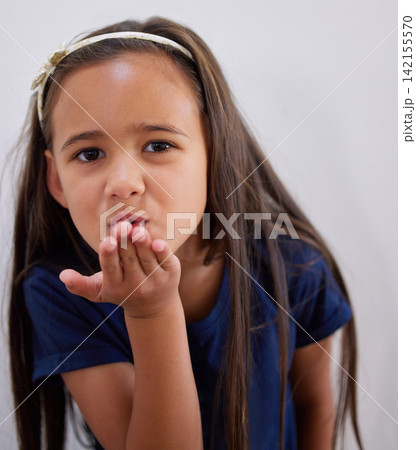 Girl, kid and portrait to blow kiss for care, kindness and love with fashion by wall in family home. Child, pout lips and emoji for connection with trendy clothes, style and symbol at house in Bogota Girl, kid and portrait to blow kiss for care, kindness and love with fashion by wall in family home. Child, pout lips and emoji for connection with trendy clothes, style and symbol at house in Bogota 142155570