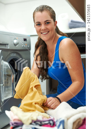Portrait, cleaning or happy woman with laundry, machine and home for clothes, fabric and housekeeping. Loading, female person and cleaner washing items in laundromat with routine, smile and service Portrait, cleaning or happy woman with laundry, machine and home for clothes, fabric and housekeeping. Loading, female person and cleaner washing items in laundromat with routine, smile and service 142155685