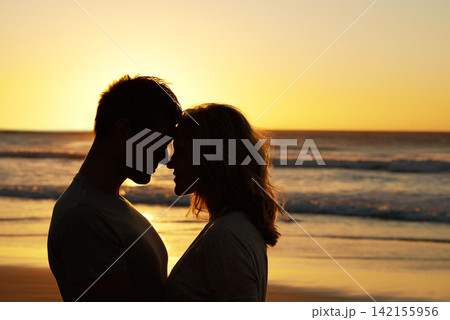 Couple, love and kiss at ocean with silhouette for date or summer holiday and bonding in Florida. Relationship, commitment and romance together as soulmate with smile, happy and vacation or honeymoon Couple, love and kiss at ocean with silhouette for date or summer holiday and bonding in Florida. Relationship, commitment and romance together as soulmate with smile, happy and vacation or honeymoon 142155956