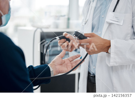 Doctor, blood pressure and patient check at hospital, healthcare and testing in assessment. Hands, consulting and cardiologist for examination at clinic, medical service and monitor heart rate 142156357